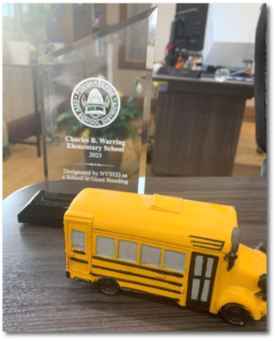  Warring Elementary receives award from District for being recognized as a Good Standing school by NYSED.